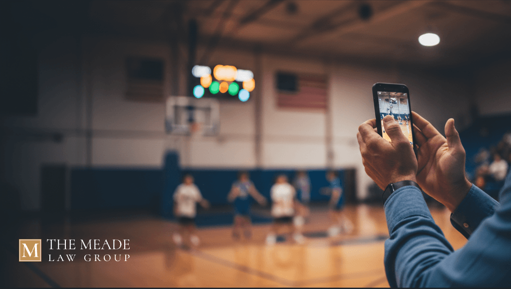 Non-custodial parent watching a child's soccer game, representing parental spectator rights and visitation in Ohio.