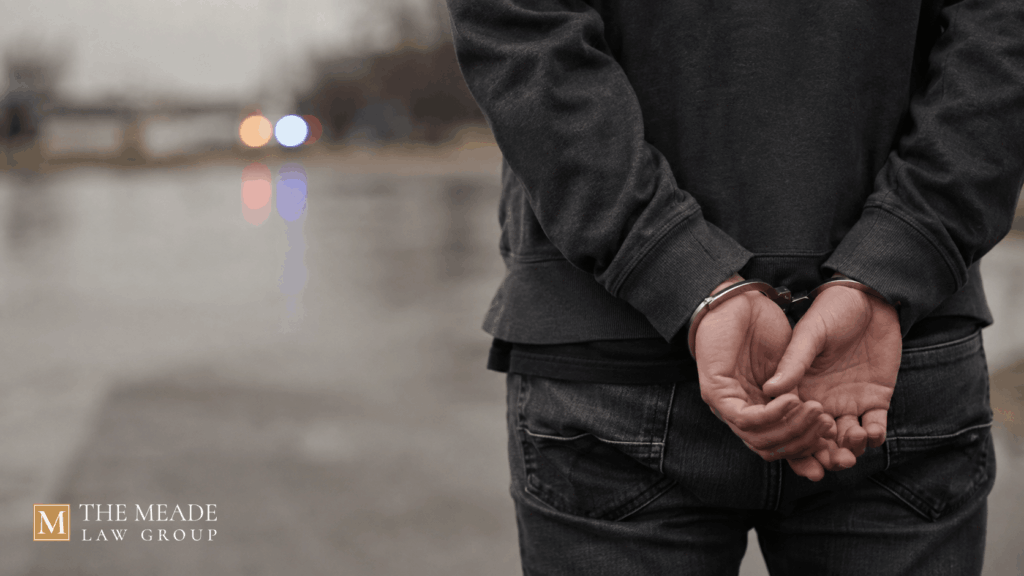 Person's handcuffed hands behind their back representing an arrest in Ohio.