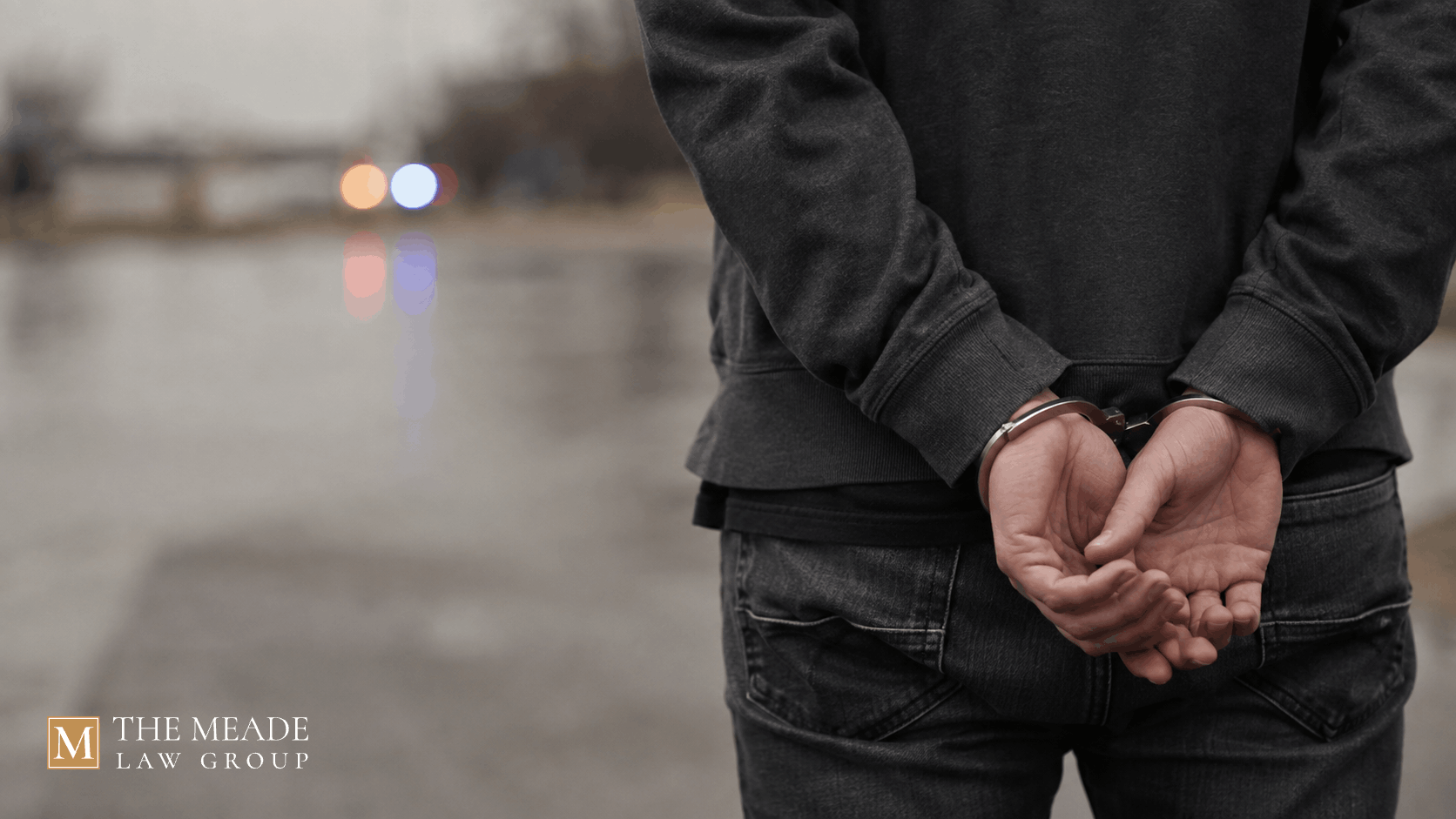 Person's handcuffed hands behind their back representing an arrest in Ohio.