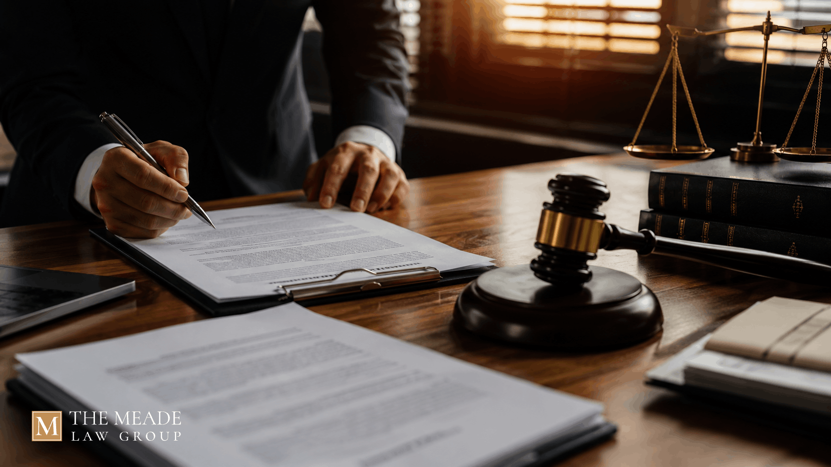 Attorney reviewing a QDRO and retirement account documents at a law office desk during an Ohio divorce.